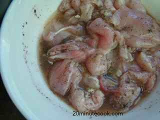 Chicken pieces being marinaded for his easy coq au vin