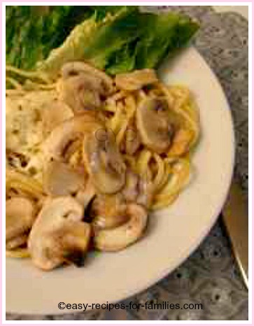 spaghetti with cheesy mushroom sauce plated